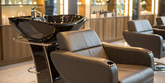 Adjustable shampoo bowl with chair in a modern professional salon.