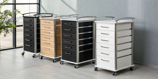 A professional salon rolling cart with drawers, shown in black, wood, and white styles.
