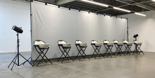 A row of the best portable shampoo chairs for professional stylists in a salon.