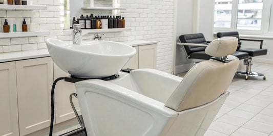 The best backwash shampoo bowl with a comfortable reclining chair in a modern salon.
