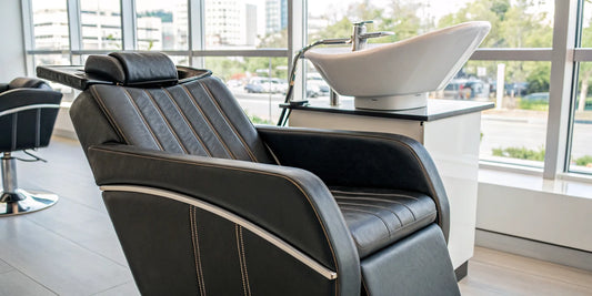 A modern and comfortable salon chair with an integrated shampoo bowl.