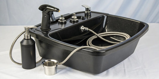 A portable shampoo bowl with a self-contained water tank and sprayer.