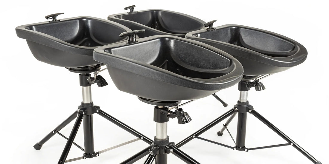 Portable shampoo bowls with adjustable stands for mobile and salon use.